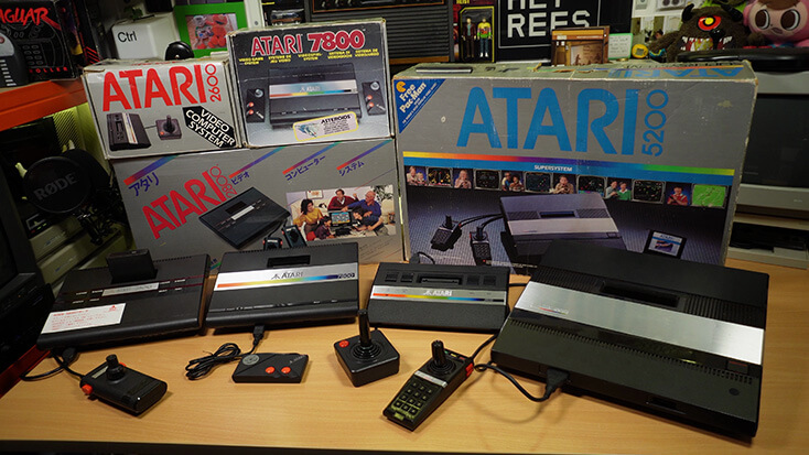 Atari 2800, 7800, 2600jr and 5200 Lined Up On Desk